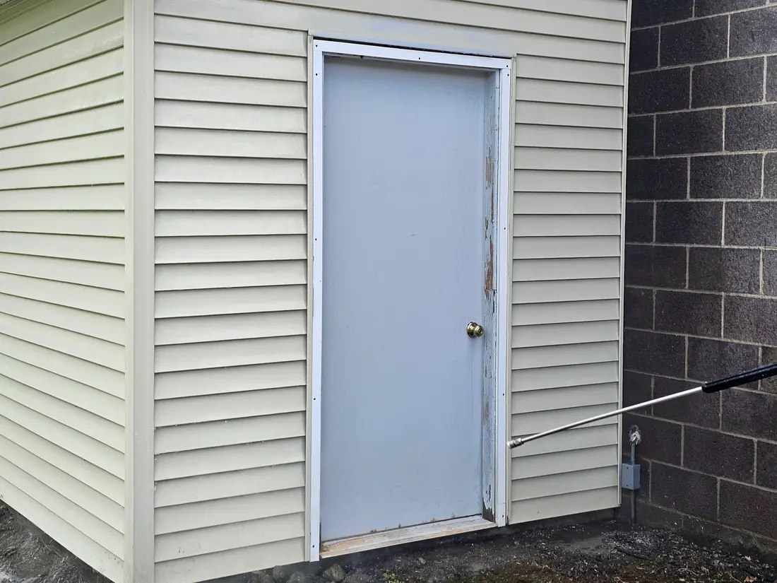After: Green-streaked vinyl shed before and after washing